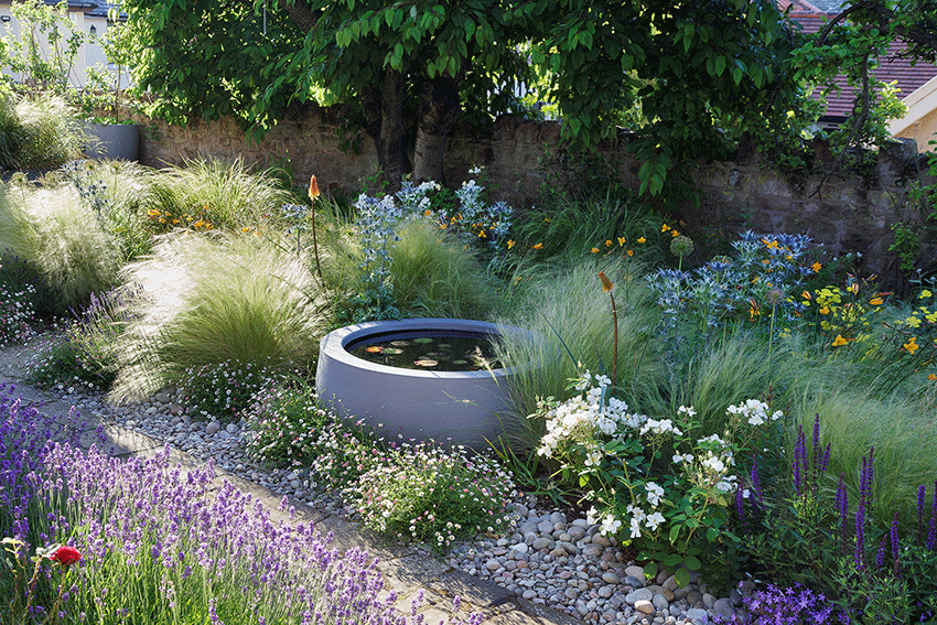 Urbis waterbowl nestled into a country cottage garden.gif